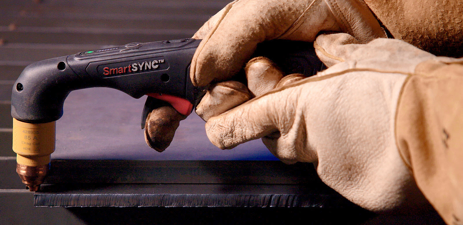 This image shows a SmartSYNC torch at the edge of a workpiece.