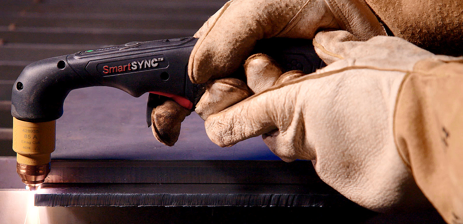 This image shows a SmartSYNC torch with a plasma arc.