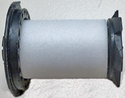 The image shows a new air filter surrounded by the plastic fittings.