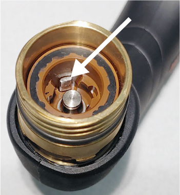 The image shows the plunger in the torch head.