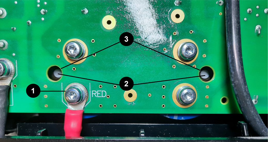 The image shows the backside of the control board showing the capacitor insertion points.